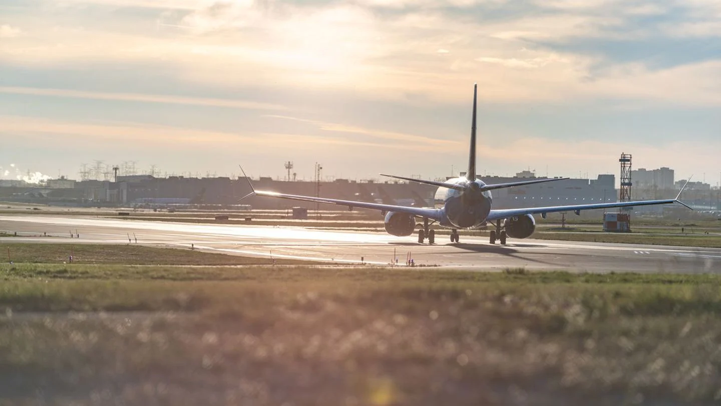 Commercial aircraft taxiing on a runway at an airport
